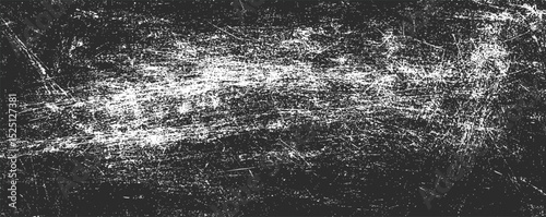 Textured black and white abstract representation of scratches and marks on a surface, exploring patterns and contrasts in minimalism