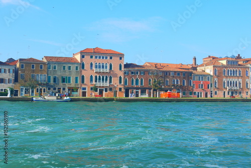 colorful houses with beautiful sunshine and clearly blue sky on the island of Venice, Italy