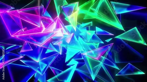 Glowing neon triangles in blue, green, and pink float and rotate in a dark space. Dynamic motion graphic creating a futuristic, crystalline visual