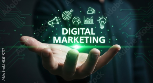 Human hand holding glowing digital marketing text and icons for online business strategy