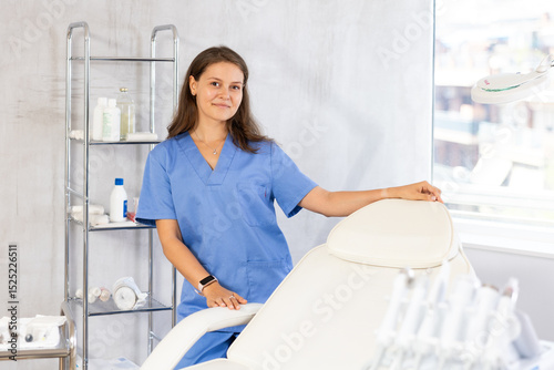 Portrait of polite female health worker meeting patient in medical office