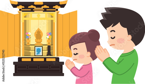 仏壇に向かって合掌する親子