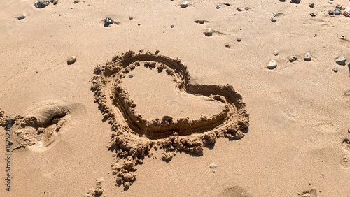 Heart-shaped sand sculpture whispers coastal romance, celebrating Tanabata under sunlit grains, ephemeral love's sandy embrace