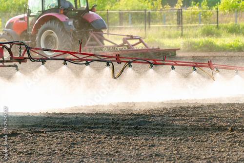 Εκτύπωση καμβά Agricultural machinery spraying crops in field on sunny day