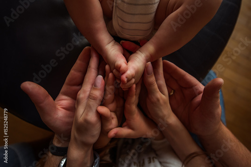Parents holding their newborn baby's tiny feet with love and tenderness, creating a heartwarming scene that captures the essence of family bonding and emotional connection