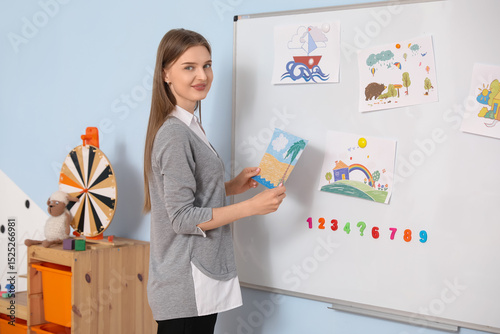 Female nursery teacher pinn...