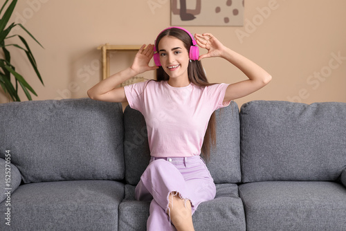 Young woman in headphones w...