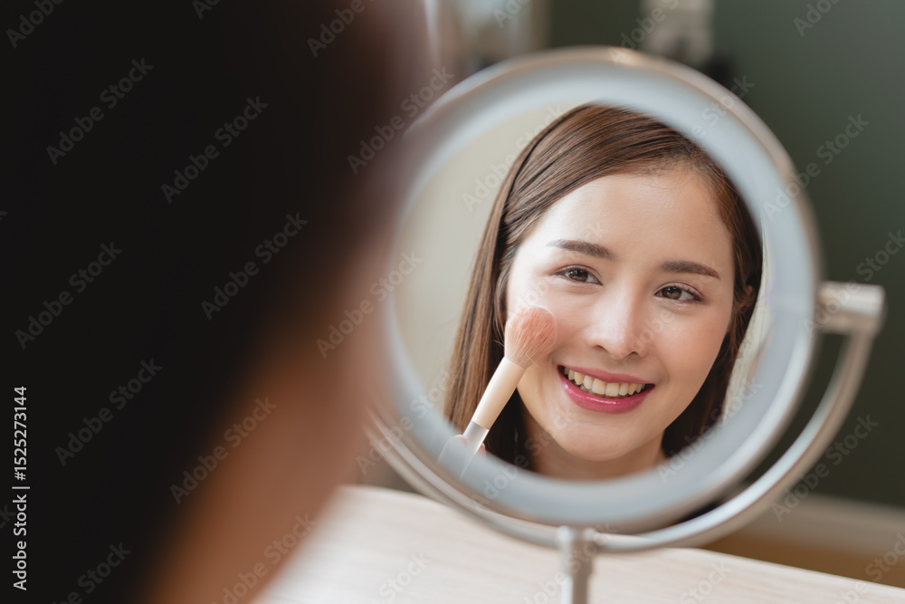 © Pormezz - Skin care, beauty cosmetics concept, pretty asian young woman, girl make up face by applying brush on, lips balm on her mouth, looking at the mirror at home. Female look with natural fashion style © Pormezz - Skin care, beauty cosmetics concept, pretty asian young woman, girl make up face by applying brush on, lips balm on her mouth, looking at the mirror at home. Female look with natural fashion style