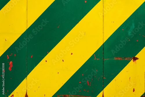 Yellow and green sheet metal background with transverse stripes