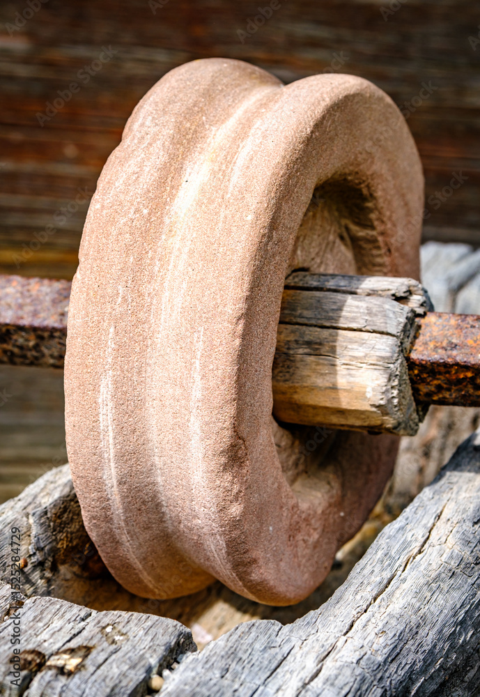 custom made wallpaper toronto digitalHistorical stone wheel used for grinding grains in a rustic farming setting during daylight hours in an outdoor environment
