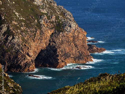 Fototapeta Naklejka Na Ścianę i Meble -  A small hole in the rock of Cabo da Roca, Sintra, Portugal on the Atlantic Ocean coast