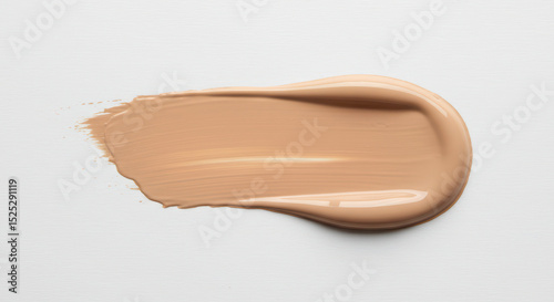 Beige foundation smear or liquid tone makeup stroke swatch.Swatch of cosmetic foundation on a white background. Beauty product for makeup application. Skincare and beauty concept.	
