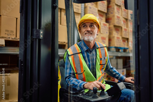 Senior forklift operator working in storage compartment of distribution warehouse.