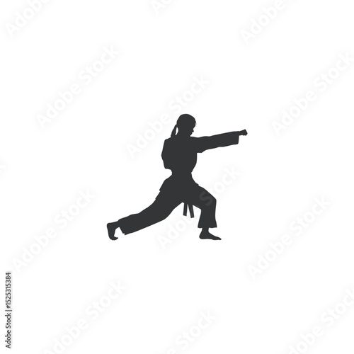 Karate fighter silhouette practicing punch technique woman in gi with belt
