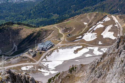 Aerial view of Seegruben cable car station of Nottekette mountain from Hafelekar station in Spring on a sunny day, Innsbruck, Tyrol, Austria