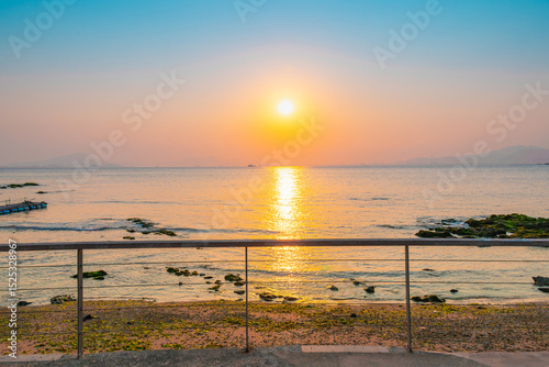 Sunset over the Calm Sea photo