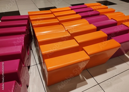 Tableau sur toile Detail of some colored plastic armchairs in a waiting room.