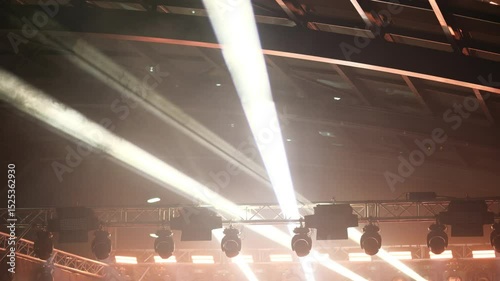 Colorful Stage Spotlight And Rays Hanging On The Ceiling Illuminate During A Music Concert