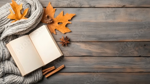 autumn on scene book concept. Cozy autumn scene with a blank book and fallen leaves on wooden surface.