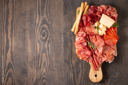 Charcuterie board. Antipasti appetizers of meat platter with salami, prosciutto crudo or jamon and olives.