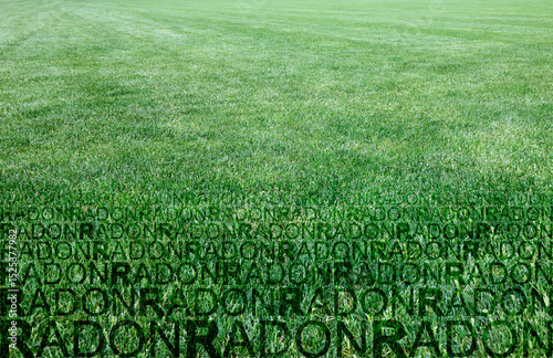 A green mowed lawn with radon gas escaping - concept image with copy space and radon text