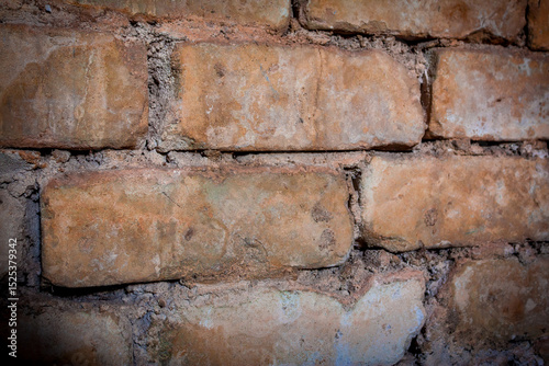 Angled perspective view of an old brick wall
