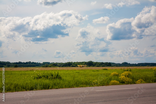 Yellow biplane on the field in Daugavpils, Latvia