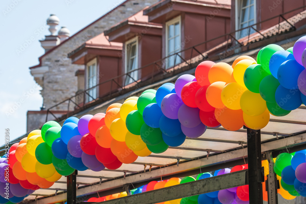 Naklejka premium Rainbow colored balloons on a truck during a LGBT+ pride parade