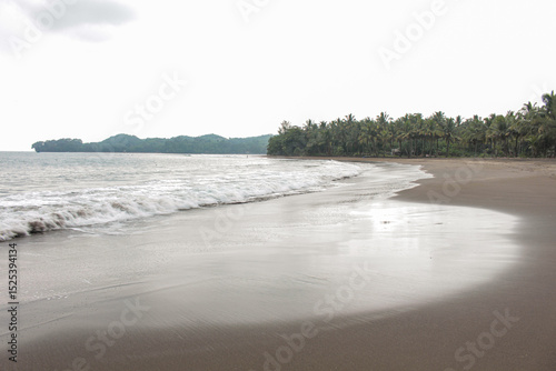 The stunning Black Sand Beach of Batukaras Pangandaran photo