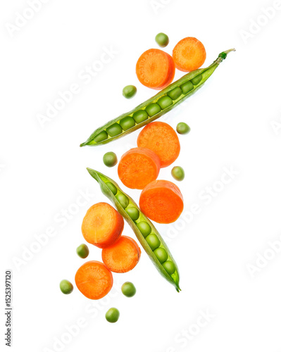 Falling carrot slice and green peas vegetales on white backgrounds.