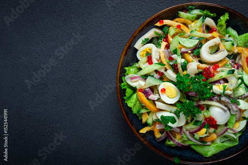 salad with squid, fresh cucumber, eggs, sweet pepper, red onion, with dressing, homemade, no people,