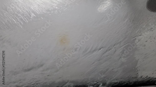 automatic car wash station in operation - inside car view