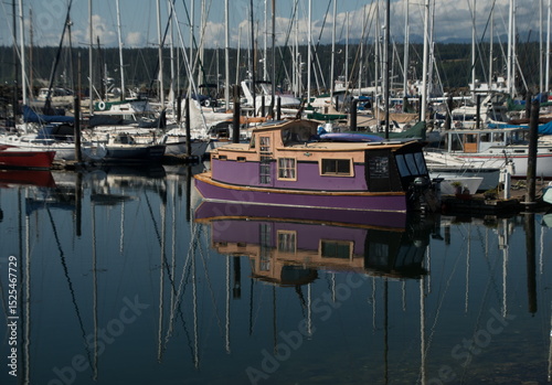 Purple boathouse docked in the middle of Boat Haven