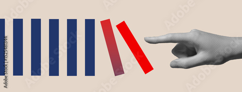 Photography Hand breaking red domino block in blue pattern