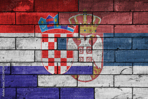 Konstfotografi colourful painted big national flag of croatia and flag of serbia on a massive old brick wall background