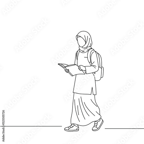 female student in hijab walking with backpack while reading a book
