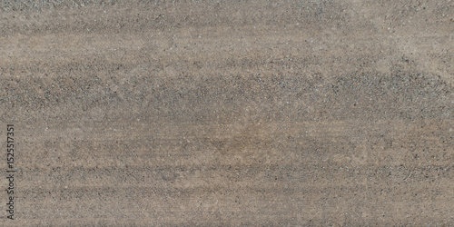 top view of gravel road surface and grass shoulder