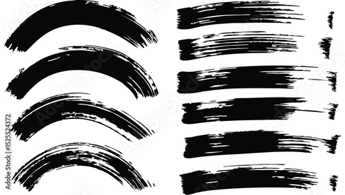 Black brush strokes in curved and straight shapes on a white surface creating a graphic design element