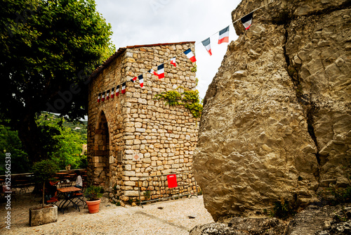 Seillans, France - July 3, 2014: A rustic building along an alleyway in the provencal village of Seillans, France
