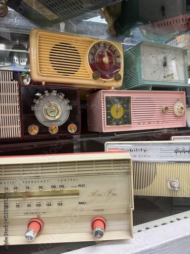 Colorful Vintage Radios and Clocks on Display Shelf