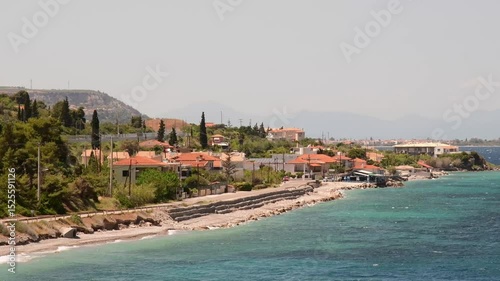 Experience breathtaking views of Mavra Litharia Greece with its pristine coastline and lush greenery. Clear blue waters meet charming coastal settlements, perfect for relaxation and exploration.