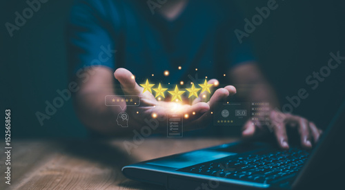Customer satisfaction concept. Hand holding golden five stars for excellent evaluate of product or service by use AI technology. Innovative leveraging AI to elevate customer service standard.