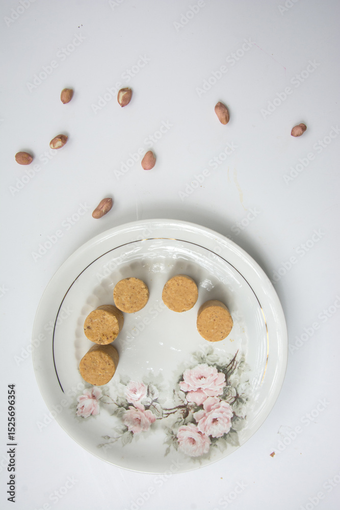 Fototapeta premium Paçoca , peanuts and crackers on a white background. Close-up.