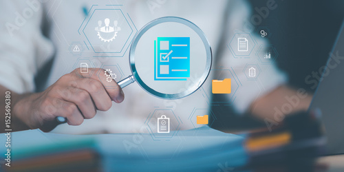 Auditor worker working with document folder ,Management of important document storage of organization ,ERP document system ,quality assessment management With a checklist ,online document database