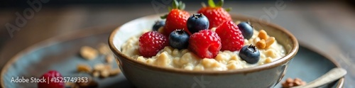 A steaming bowl of creamy oatmeal topped with fresh berries and nuts, ready to be enjoyed for a healthy and delicious breakfast , seeds, nuts, superfood