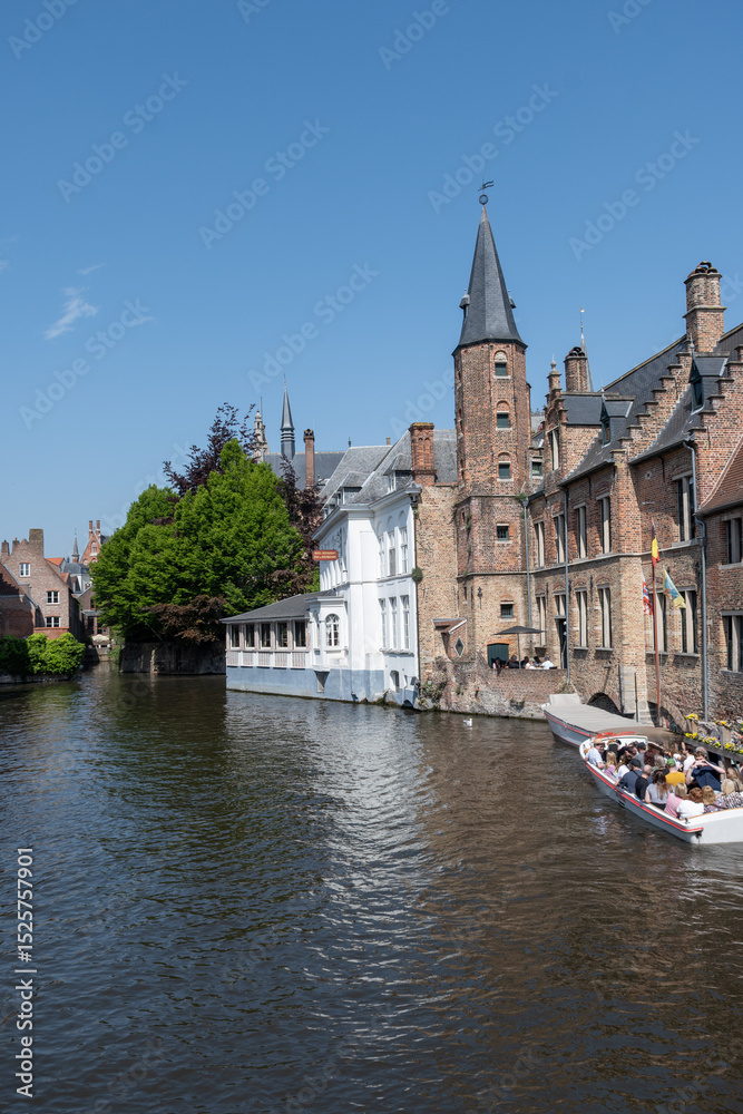 Fototapeta premium Views of canals, briges and old facades of medieval buildings in Bruges, Flanders, Belgium, travel destination