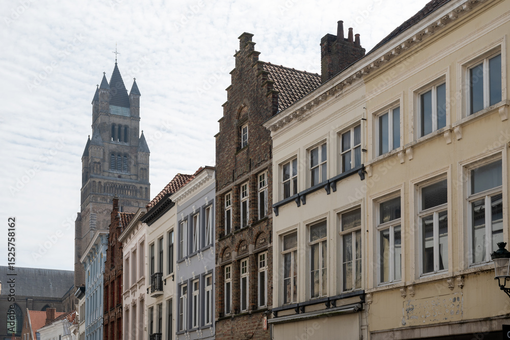 Fototapeta premium Medieval houses facades and rooftops and city tower with bells in the centre of Bruges, Flanders