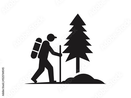 Silhouette of a hiker trekking with a backpack and walking stick next to a pine tree.