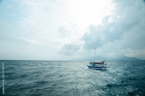 Minimal Aerial View of a Sailing Boat on the Blue Sea