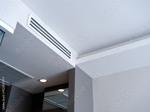 Wallpaper Mural From bottom view of air conditioning wall mounted ventilation system on ceiling in white clean hotel guest room background. Hotel room air ventilation grill on the wall. Torontodigital.ca